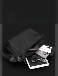 Detailed interior storage view of a durable nylon tactical messenger bag with gadgets