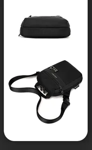 Vista dettagliata della trama del tessuto in nylon nero e della cerniera della borsa da uomo