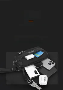 Detail of waterproof nylon waist bag with multiple compartments showing phone and power bank