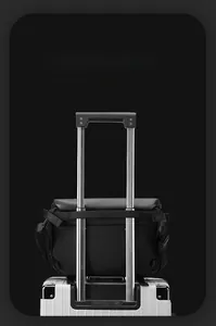 Detail of the luggage strap on a black tactical messenger bag for easy travel