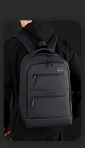 Macro shot of durable charcoal gray nylon fabric texture and straps on the backpack