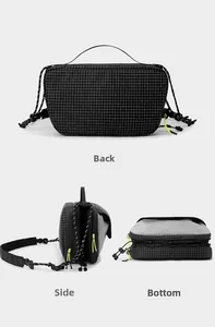 Detailed views of the back side and bottom of a black grid textured crossbody bag