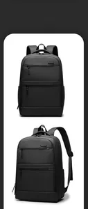 Detail view of black commuter backpack featuring multi-layered zipper compartments