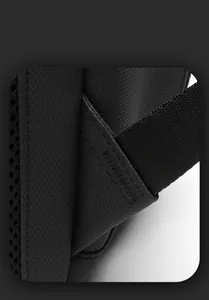 Detail of waterproof fabric with reinforced stitching and honeycomb mesh on black backpack