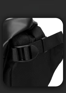 Close-up of waterproof fabric textures and durable plastic buckles on black biker messenger bag