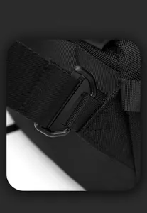 Detail of adjustable shoulder strap buckle on black nylon motorcycle messenger bag