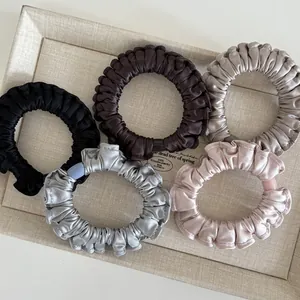 Five pack of pleated satin scrunchies in neutral silk colors for hair styling