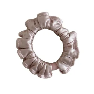 Elastic satin ruffled scrunchie in pale pink violet silk-like finish for hair styling