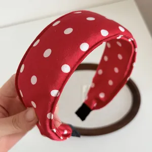French Hepburn style red headband with white polka dots and thick sponge padding