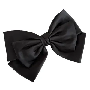 Elegant triple-layered black satin bow hair clip with matte finish on white background