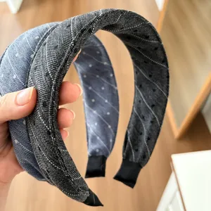 Detail of wide padded headbands with polka dots and stripes texture in blue and gray