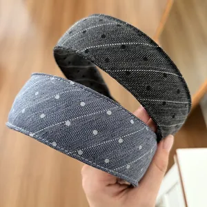 Detail of wide denim texture headbands in dark grey and light blue with dot patterns