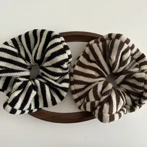 Chic knitted oversized scrunchies in brown and black striped patterns for women
