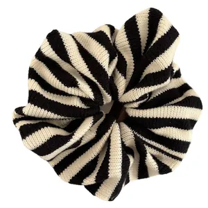 Knitted black and white striped scrunchie with minimalist pleated texture hair accessory