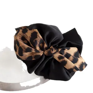 Elegant large leopard print and black satin bow hair claw clip for bun hairstyles
