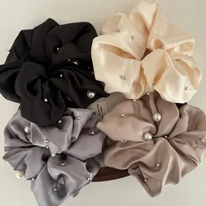 Set of four oversized satin scrunchies with faux pearls and metal studs for women