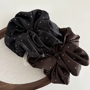 Elegant satin hair scrunchies set with sparkling rhinestones in black and brown