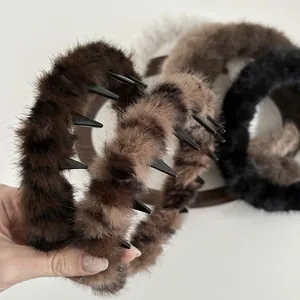 Close-up of plush wave headbands with built-in black plastic teeth for secure hair grip