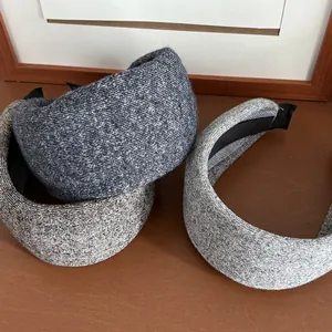 Detail of thick knitted headbands with sponge filling in navy, dark coffee, and light grey