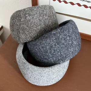 Detailed knit texture on wide sponge headbands in dark coffee, navy, and light grey