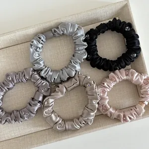 Five silk satin scrunchies with crystal beads in grey black and champagne gold colors
