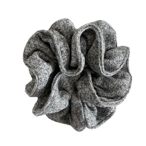 Elegant grey marl knitted scrunchie with fluffy texture for soft bun hairstyles