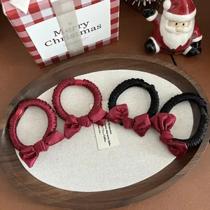 Elegant 4-piece bow scrunchie set in red and black satin finish for festive hair styling