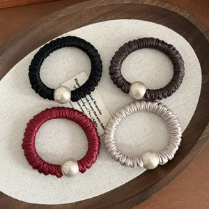 Set of 4 pleated satin hair scrunchies with pearls in black, brown, red and champagne