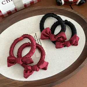 Elegant satin bow scrunchies set in black and red for women, perfect for ponytails