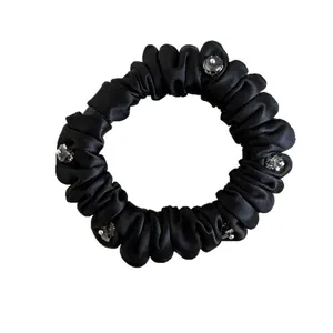 Elegant black satin scrunchie with crystal rhinestones for minimalist women hairstyles