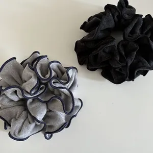 Plump wool blend oversized scrunchies in gray and navy blue with contrast edging