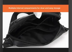 Multi-layered interior of the black crossbody bag showing organized storage compartments