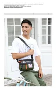Sac bandoulière homme en nylon imperméable vert avec détail de fermeture éclair orange