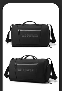 Détail du sac de voyage de sport noir à grande capacité avec poignées renforcées et poche latérale