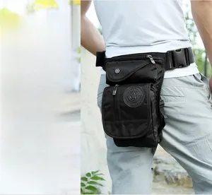 Detail of multi-pocket black nylon leg bag with adjustable straps for outdoor hiking
