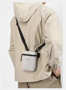Adjustable tactical strap and buckle on a minimalist lightweight crossbody sports bag