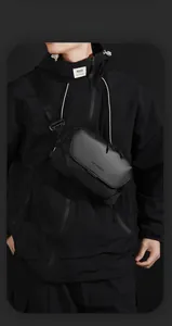 Detailed view of black waterproof crossbody bag with magnetic buckle and WE POWER logo