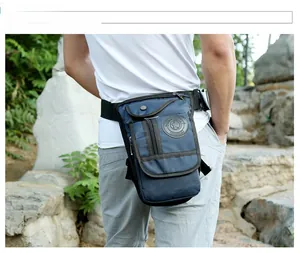 Outdoor model shot of a durable navy nylon tactical drop leg bag with multi-pockets