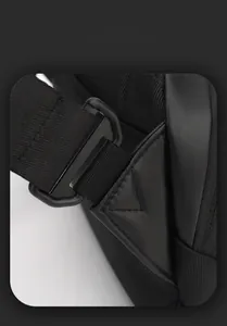 Detail view of reinforced triangular stitching on durable waterproof black crossbody bag strap