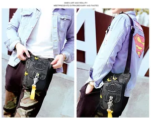 Close-up of waterproof tactical leg bag showing multi-pocket zippers and D-ring buckle