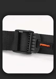 Detail of crossbody bag strap with matte buckle and orange reinforced stitching