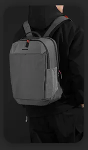Detail of breathable honeycomb mesh shoulder straps and logo on grey business backpack