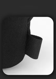 Macro view of durable woven fabric texture and reinforced side webbing on a men's chest bag