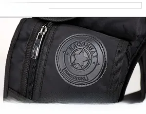 Detail showing the HAOSHUAI brand logo and textured nylon fabric on black tactical leg bag