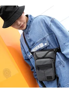 Detail view of the waterproof tactical leg bag with multiple zipper compartments