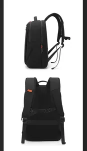 Detail view of ergonomic breathable mesh shoulder straps and quilted back on black backpack