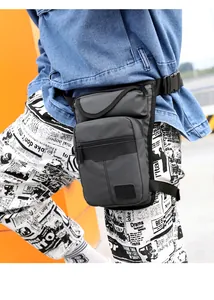 Detail of waterproof tactical drop leg bag with adjustable straps on dark grey nylon
