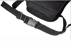 Close-up of durable black plastic buckle and nylon webbing on tactical drop leg bag