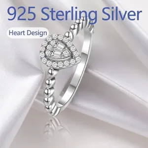 925 sterling silver ring featuring a heart-shaped cluster design with beaded textured band