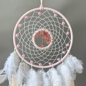 Handmade pink dreamcatcher with crystal tree of life and white feathers for wall decor